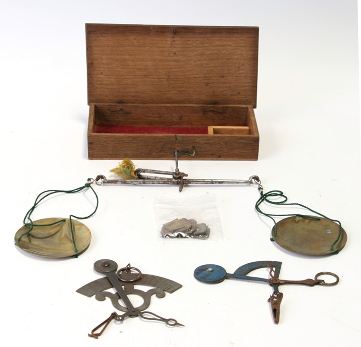 A 19th century boxed set of Travelling Apothecary Scales complete with 12 weights, together with two