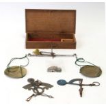 A 19th century boxed set of Travelling Apothecary Scales complete with 12 weights, together with two