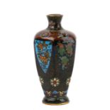 A late 19th century Japanese Meiji period miniature cloisonne vase, decorated with flowers on