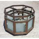 A painted metal and frosted glass ceiling light of octagonal form, 51cm (20ins) wide.