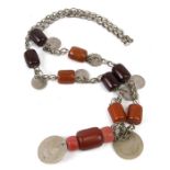 A tribal coin and Bakelite bead necklace.
