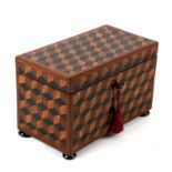 A 19th century Tunbridgeware tumbling block two-division tea caddy, 21cms (8.25ins) wide.Condition