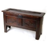 An 18/19th century carved oak coffer, 113cm (43.5ins) wide