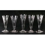 A group of mixed glasses to include etched flutes and bubble stem examples, the largest 25cm (9.