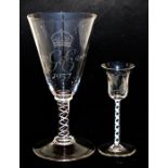 A 1937 Royal commemorative oversized glass with air twist stem, 23cm (9ins) high; together with an