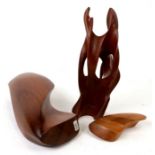 Three 1970's treen abstract sculptures, one signed Rod Naylor, the largest 30cms (12ins) high (3).