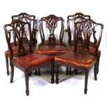 A set of eight late 19th / early 20th century Georgian style mahogany dining chairs with stuffover