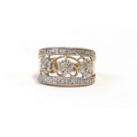 A 9ct gold ring set with diamond floral clusters, approx UK size K, weight 3.7g.
