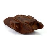 A nicely carved hardwood WW1 trench art Tank. Overall length 22cms (8.75ins)