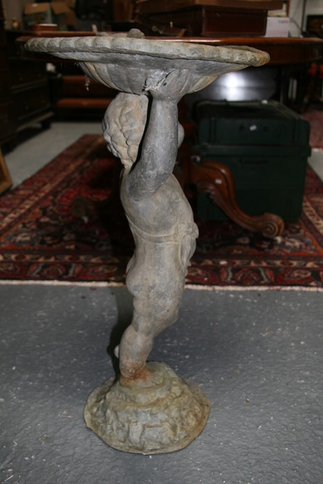 A lead birdbath in the form of a cherub, 70cms (27.5ins) high. - Image 4 of 9