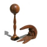 An antique novelty Black Forest Gnome nut cracker; together with a treen Bilboquet (cup and ball)