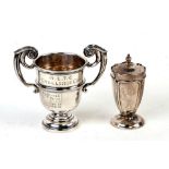 A small silver trophy vase, engraved, Sheffield 1906, together with an Arts & Crafts silver pepper