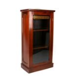 A mahogany glazed cabinet with shelved interior and glass door with gilt lettering 'Havana