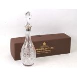 A silver collared cut glass decanter by Garrard of London, in original box. Condition ReportMinor