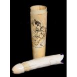 A large carved ivory phallus housed in a turned ivory box engraved with a scantily clad lady 25cm (