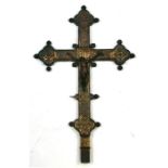A late 19th century gilt metal crucifix, 56cms (22ins) high.