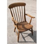 A stripped elm country carver chair.