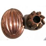 A copper jelly mould, numbered N100.5 1/2, 10cms (4ins) high; together with an oval copper jelly