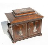 An early 19th century rosewood jewellery box with lift-up lid and fitted interior with two doors