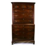 A George III figured mahogany chest on chest with three short and three long drawers above four