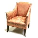 An Edwardian armchair on square tapering legs.Condition Reportfabric faded and has a repair to the