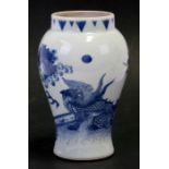 A Chinese blue and white vase decorated with a dragon and bamboo, 19cm (7.5ins) high.Condition