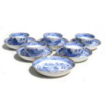A group of five blue & white tea bowls and six saucers, decorated with an Oriental scene, possibly