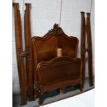 A pair of continental carved walnut single bed frames.