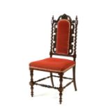 A Victorian mahogany occasional chair with upholstered seat and back on turned supports,