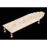 A 19th century Chinese Canton export carved ivory cribbage board decorated with figures within