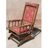 An American rocking chair with upholstered seat and back