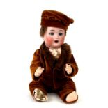 A German Bisque headed doll with open mouth and sleeping blue eyes, composite jointed body, marked