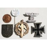 A quantity of WWII badges to include the Iron Cross.