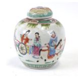 A Chinese famille rose ginger jar, decorated with figures in a procession with associated cover;