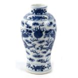 A Chinese blue and white vase decorated dragons chasing a flaming pearl amongst clouds, 17cm (6.