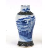 A Chinese blue & white crackle glaze vase decorated with a mountainous landscape, incised seal