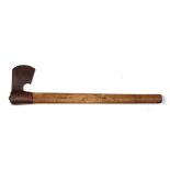 An antique iron axe on a wooden shaft. The axe head is 16cms (6.25ins) by 9cms (3.5ins)