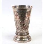 A George II silver plated gamblers tankard inset with coins and three bone dice under glass to the