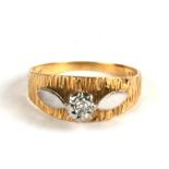 An 18ct gold modern design solitaire diamond ring, approx UK size 'O'.