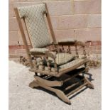 An American rocking chair with upholstered seat and back