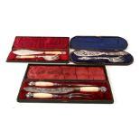 Three cased cutlery sets, two pairs of fish servers and a three-piece carving set.