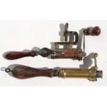 Two Victorian brass shotgun cartridge re-loaders with turned wooden handles, the largest 24cms (9.