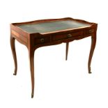 A French Louis XV style writing table, the rectangular leather inset top above three frieze drawers,