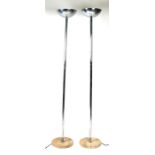 A pair of modern design chrome uplighters on marble bases, 178cms (70ins) high.