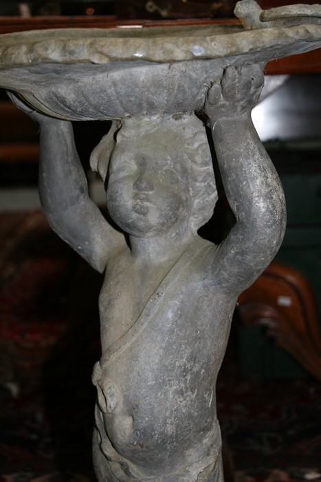 A lead birdbath in the form of a cherub, 70cms (27.5ins) high. - Image 8 of 9