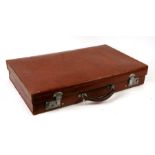 A gentleman's slimline leather suitcase, 61cm (24ins) wide.