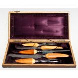 A Victorian five-piece carving set with silver collars, Sheffield 1893, in original walnut box.
