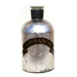 A large decorative silvered glass bottle with gilt letters "Laudanum", 42cm (16.5ins) high.