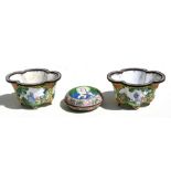 A small pair of Chinese enamel planters of lobed form, decorated with figures on a yellow ground,