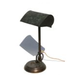 An early 20th century adjustable brass desk lamp with weighted base, 41cms (16ins) high.